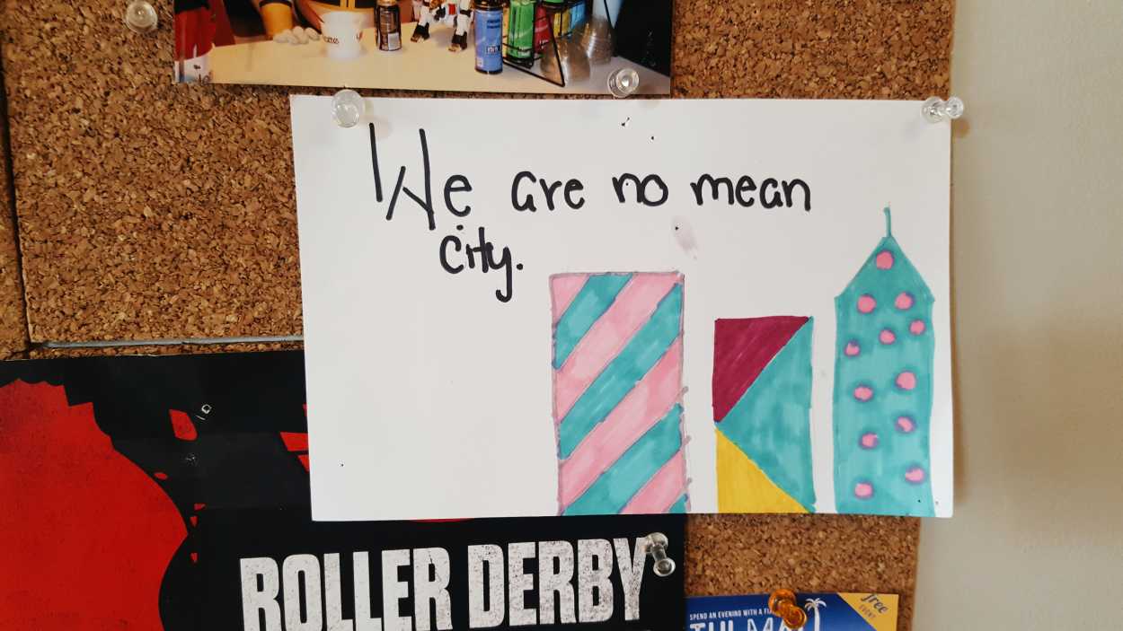A child's work of art that reads "We are no mean city"