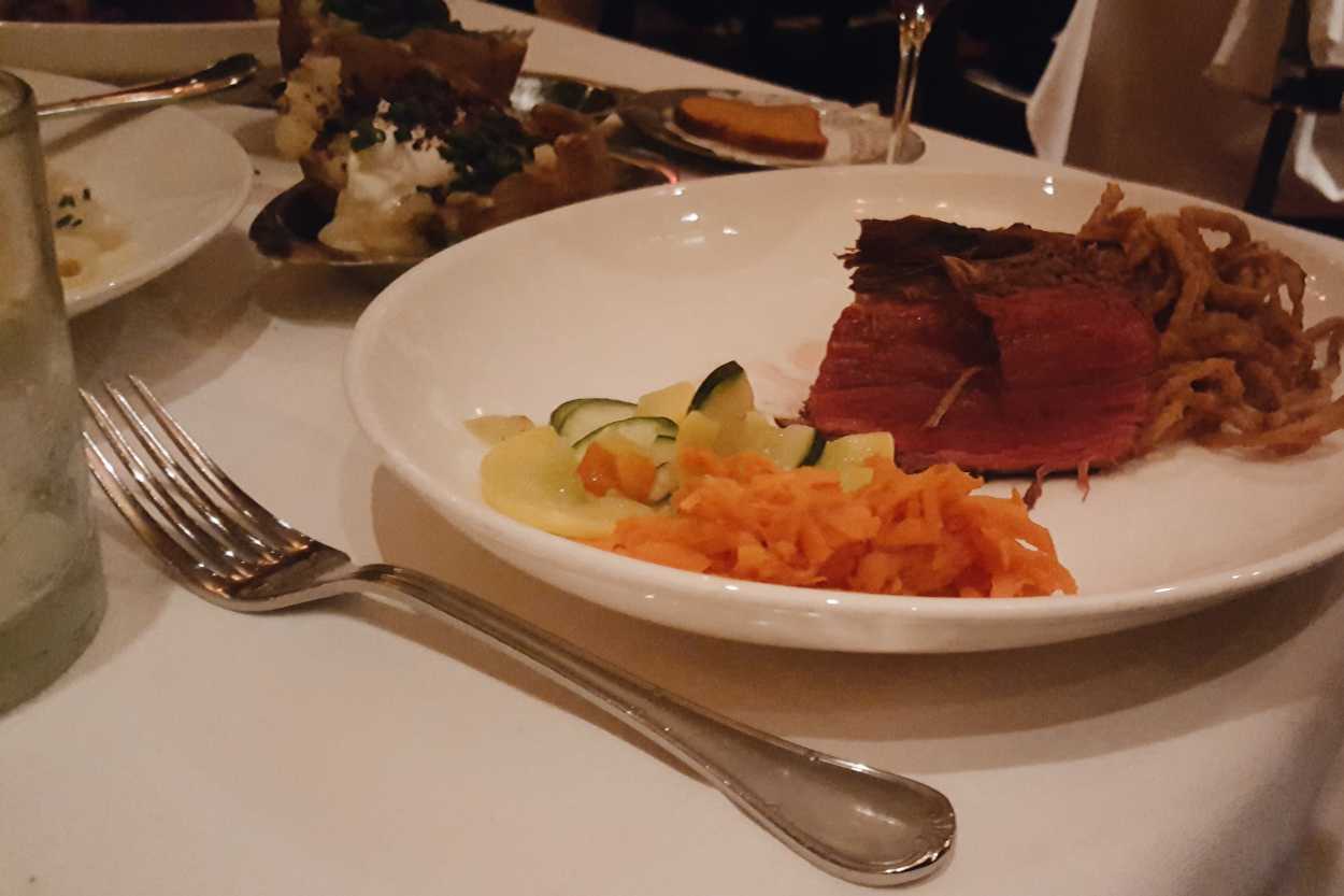 A plate of steak and vegetables