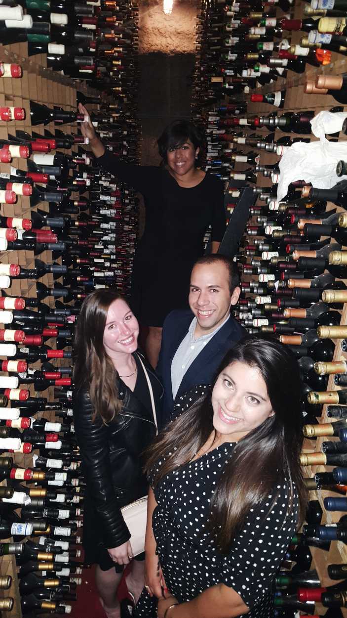 Alyssa, Michael, and family in Bern's wine cellar