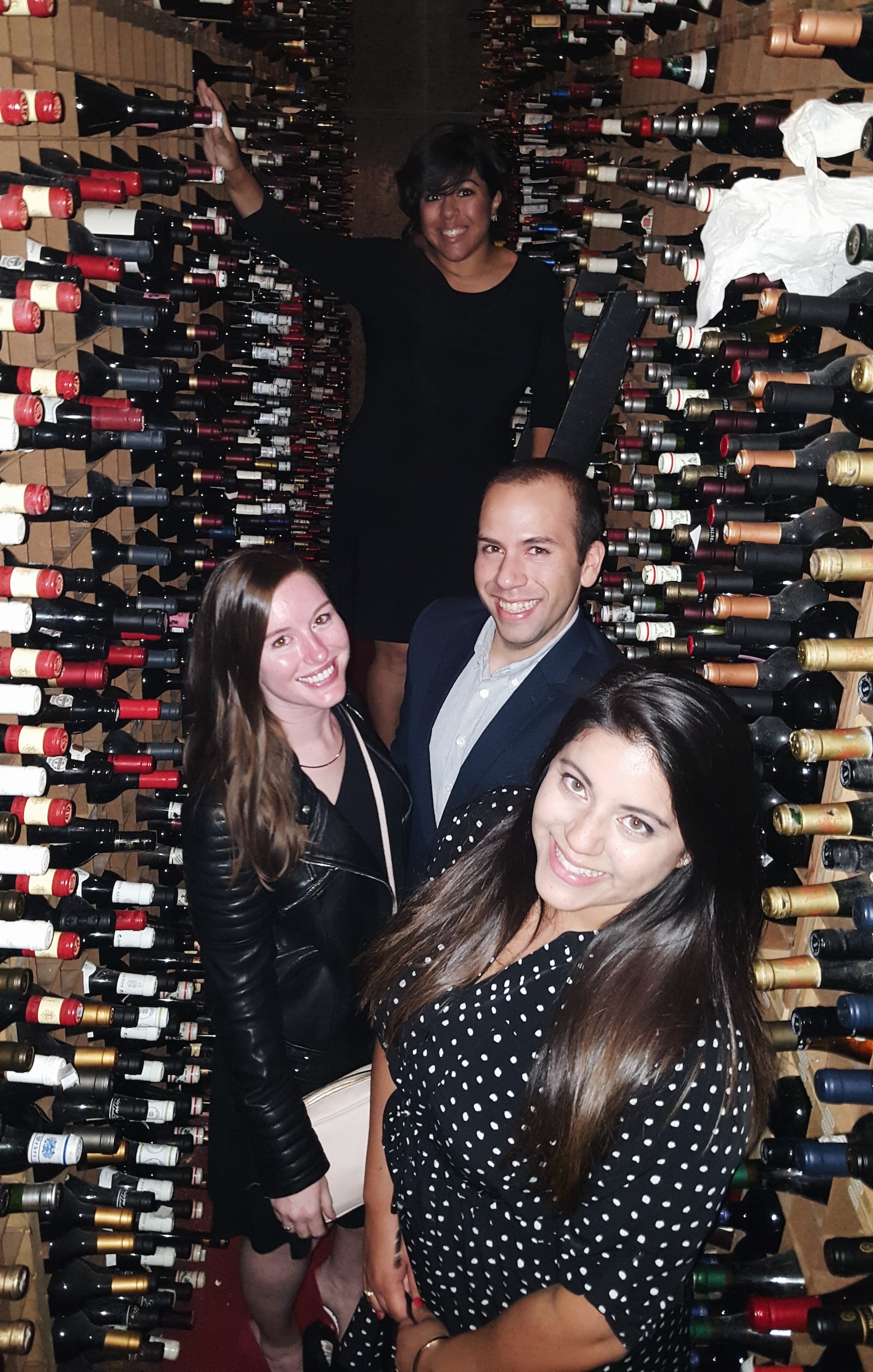 Alyssa, Michael, and family in Bern's wine cellar