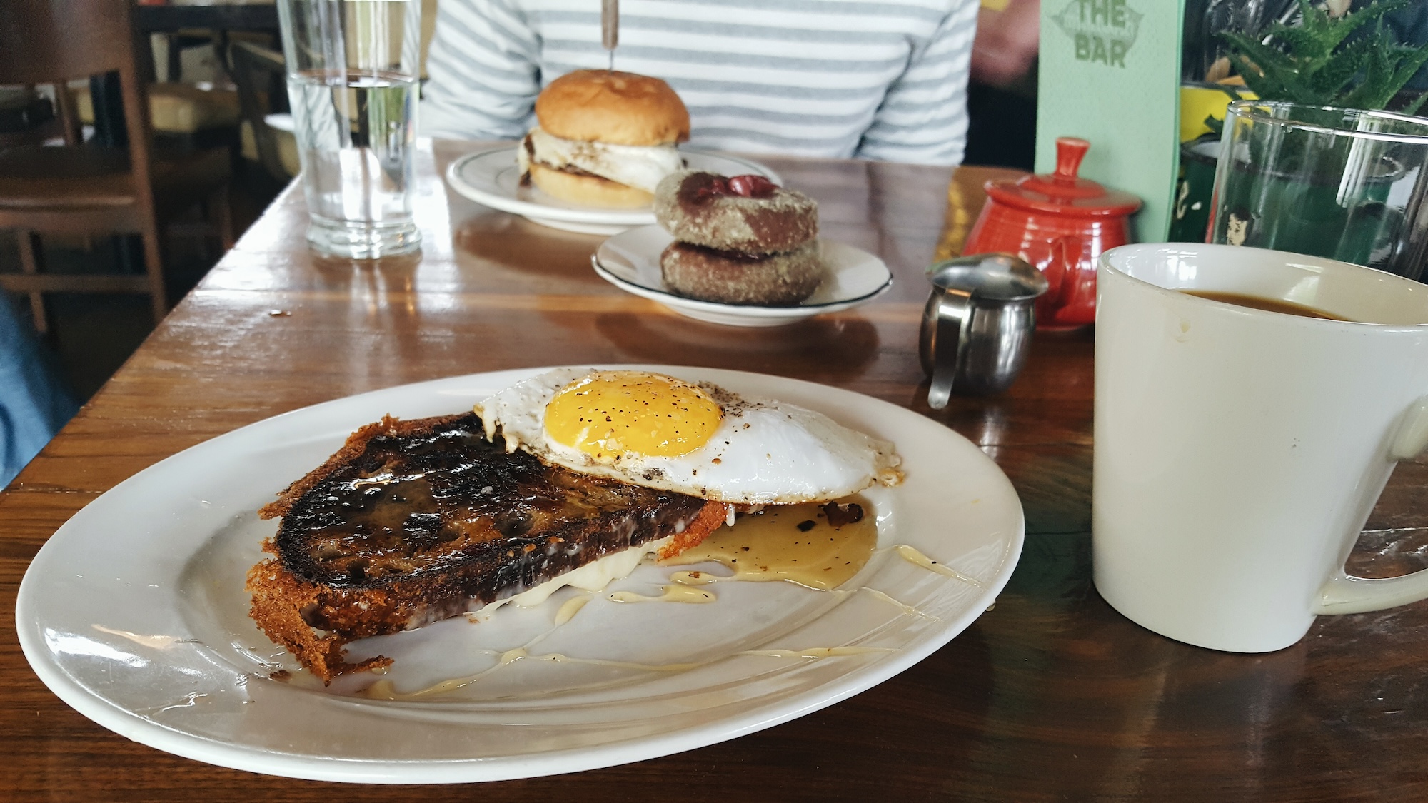 a fried egg, donuts, and burger