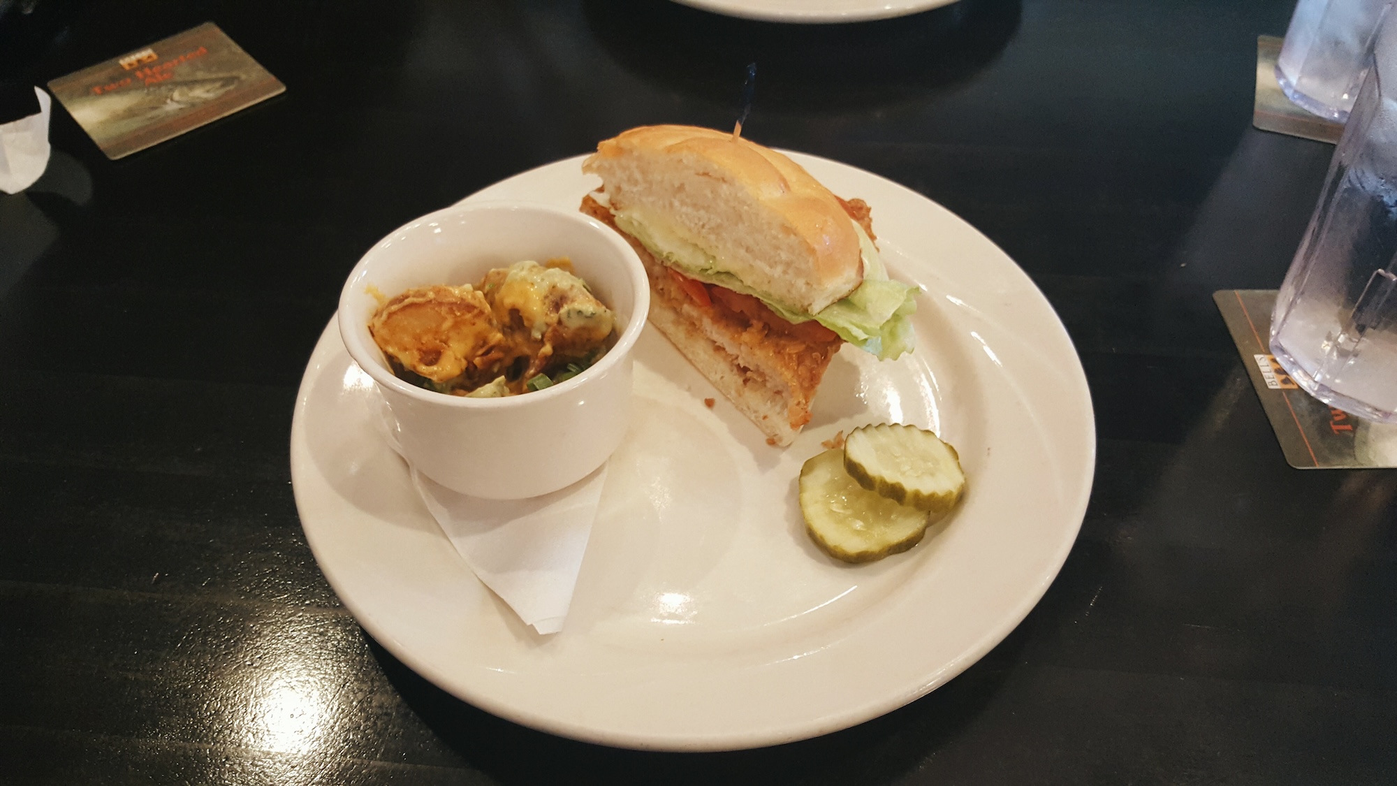 A half pork tenderloin sandwich on a plate