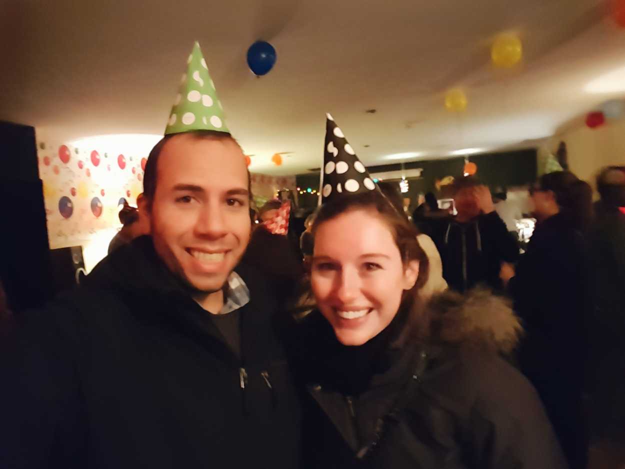 Michael and Alyssa wear paper birthday hats
