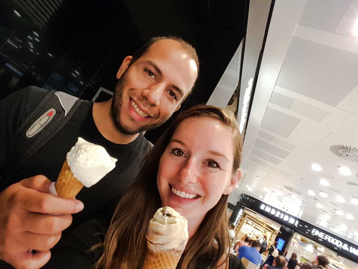 Alyssa and Michael eat gelato at the airport in Milan
