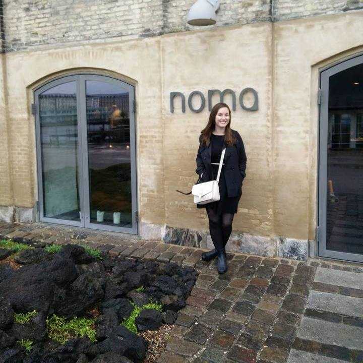 Alyssa stands in front of Noma in Copenhagen