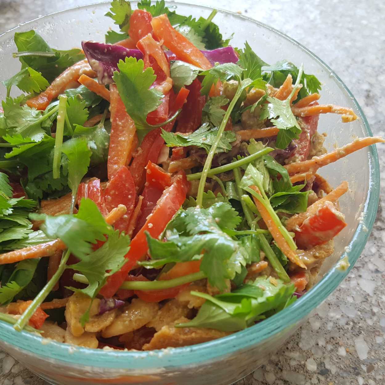 A glass bowl of Fresh Thai Salad with Cayenne Cashews