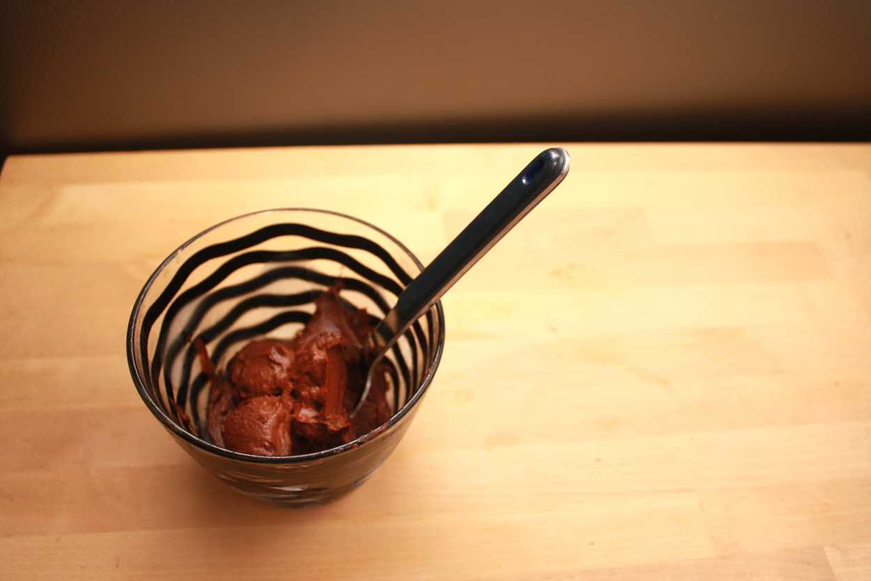 A glass bowl containing Mexican Hot Chocolate Avocado Mousse