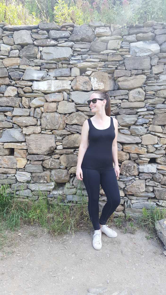 Alyssa in a tank top and leggings