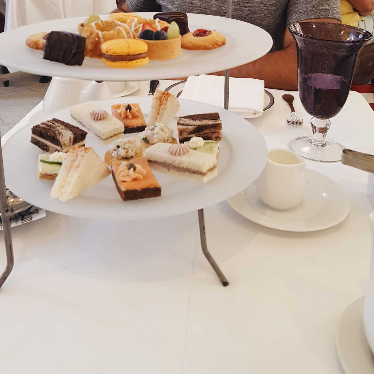 A table with sweets and mini sandwiches at the Boston Public Library