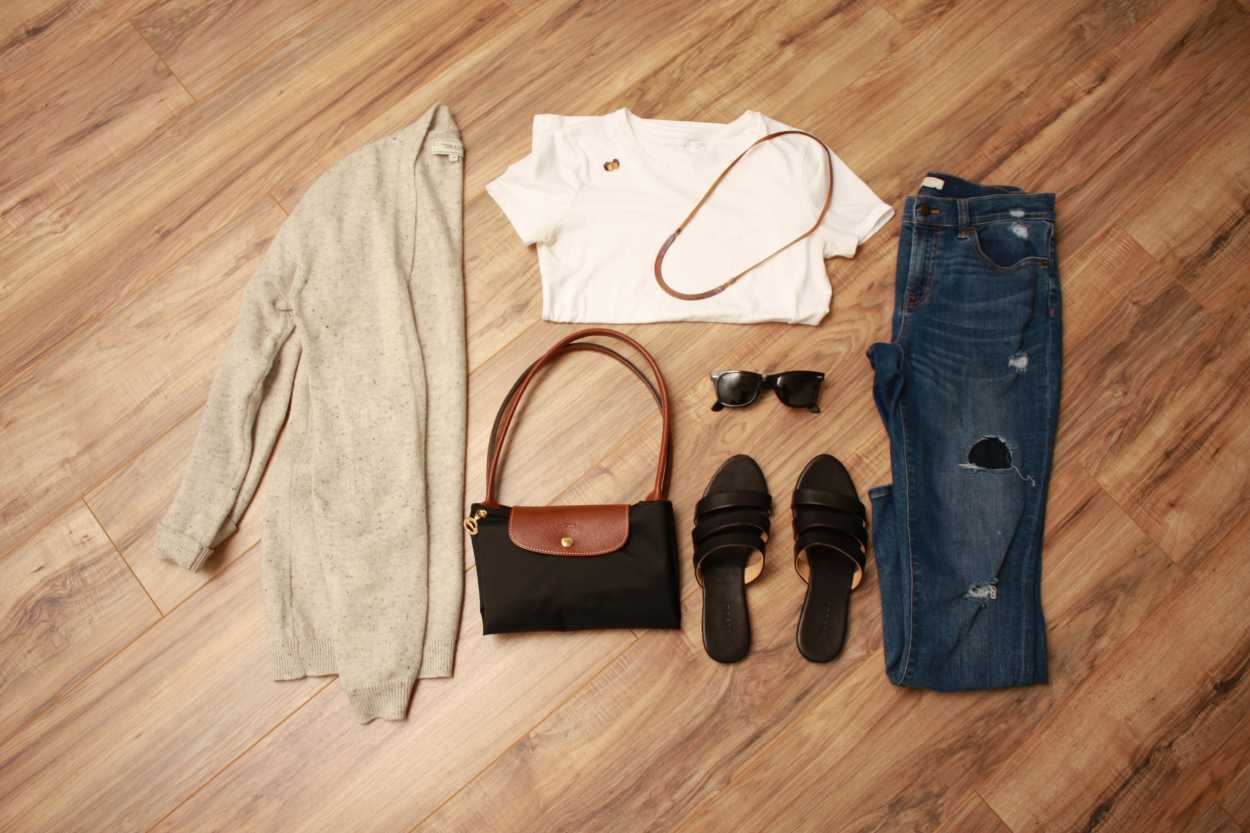 Flat lay for the Nashville Packing List: white tee, grey cardigan, black longchamp, black sandals, blue jeans