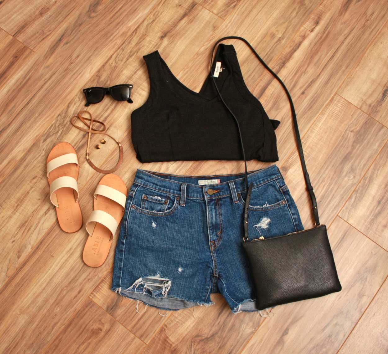 Nashville outfit Flat lay: black tank, denim shorts, white sandals, black purse