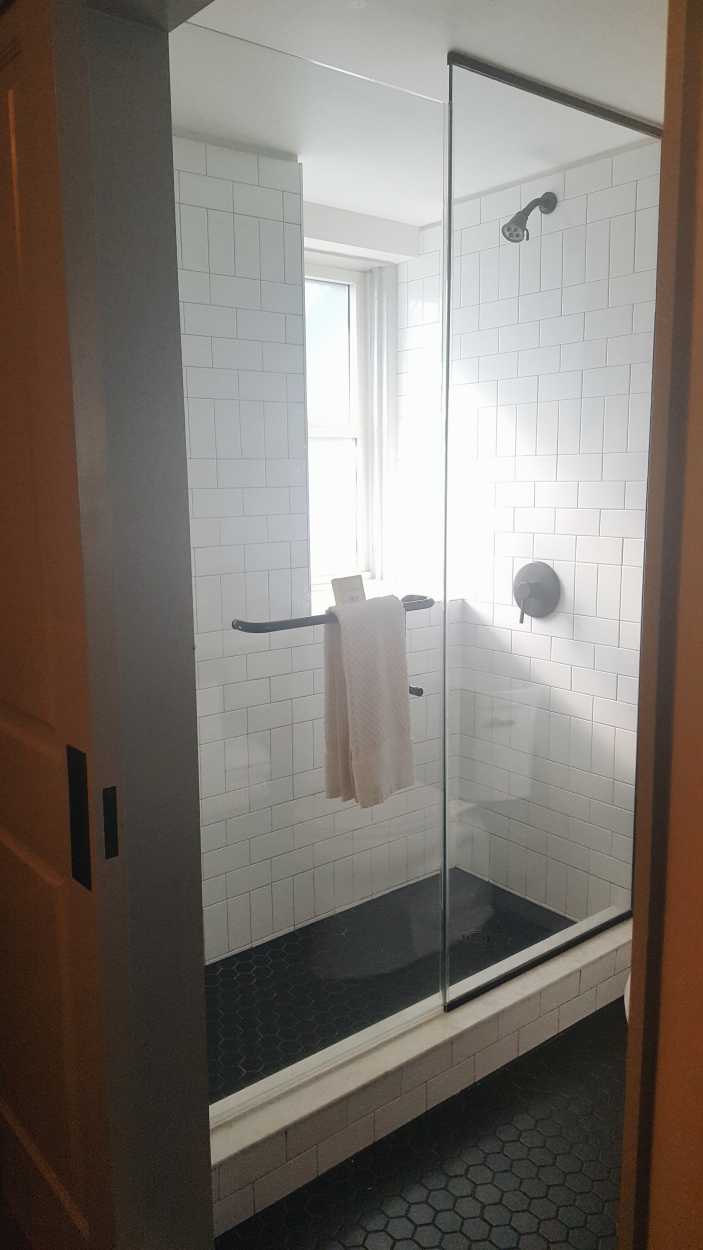 A glass and tile shower