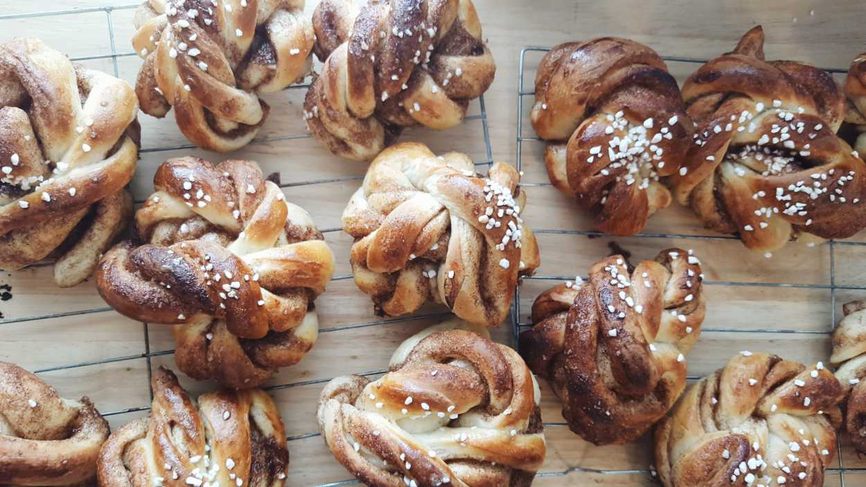 trays with homemade cinnamon buns