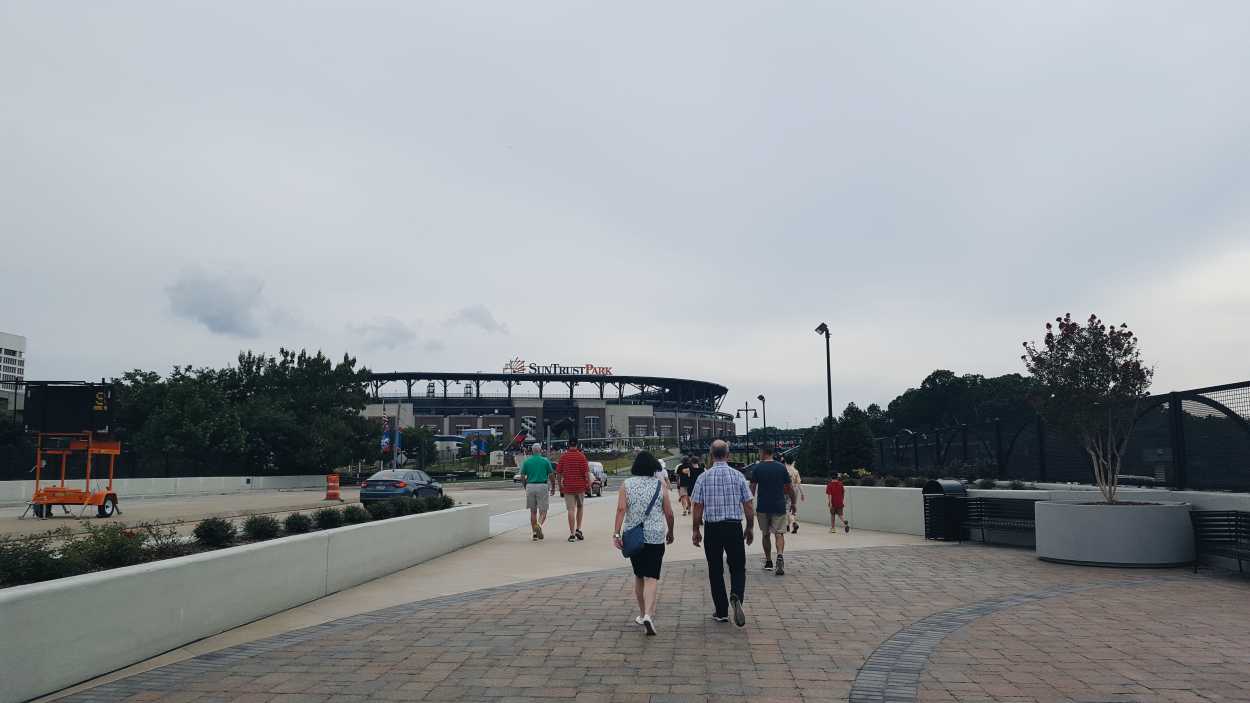 A crowd walks toward the SunTrust Park Entrance