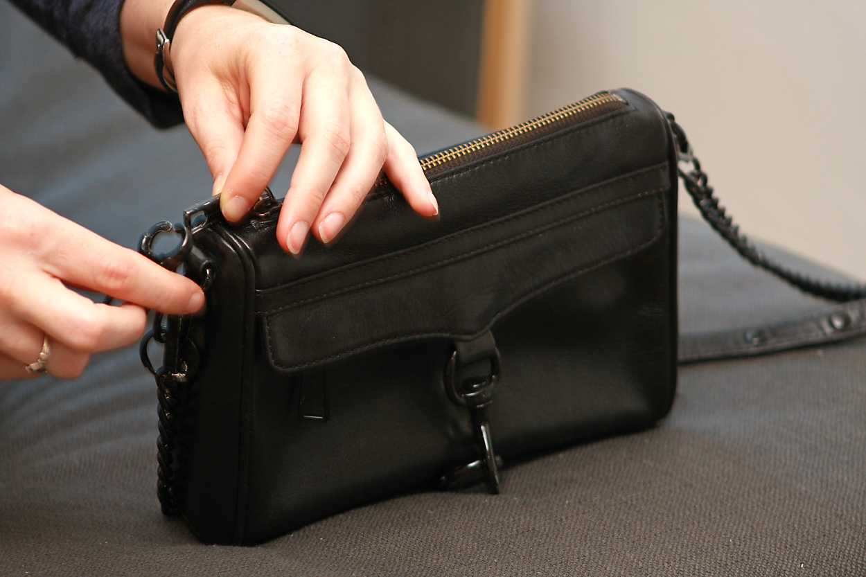 Alyssa shows an added clasp on the Mini Mac purse from Rebecca Minkoff in Black
