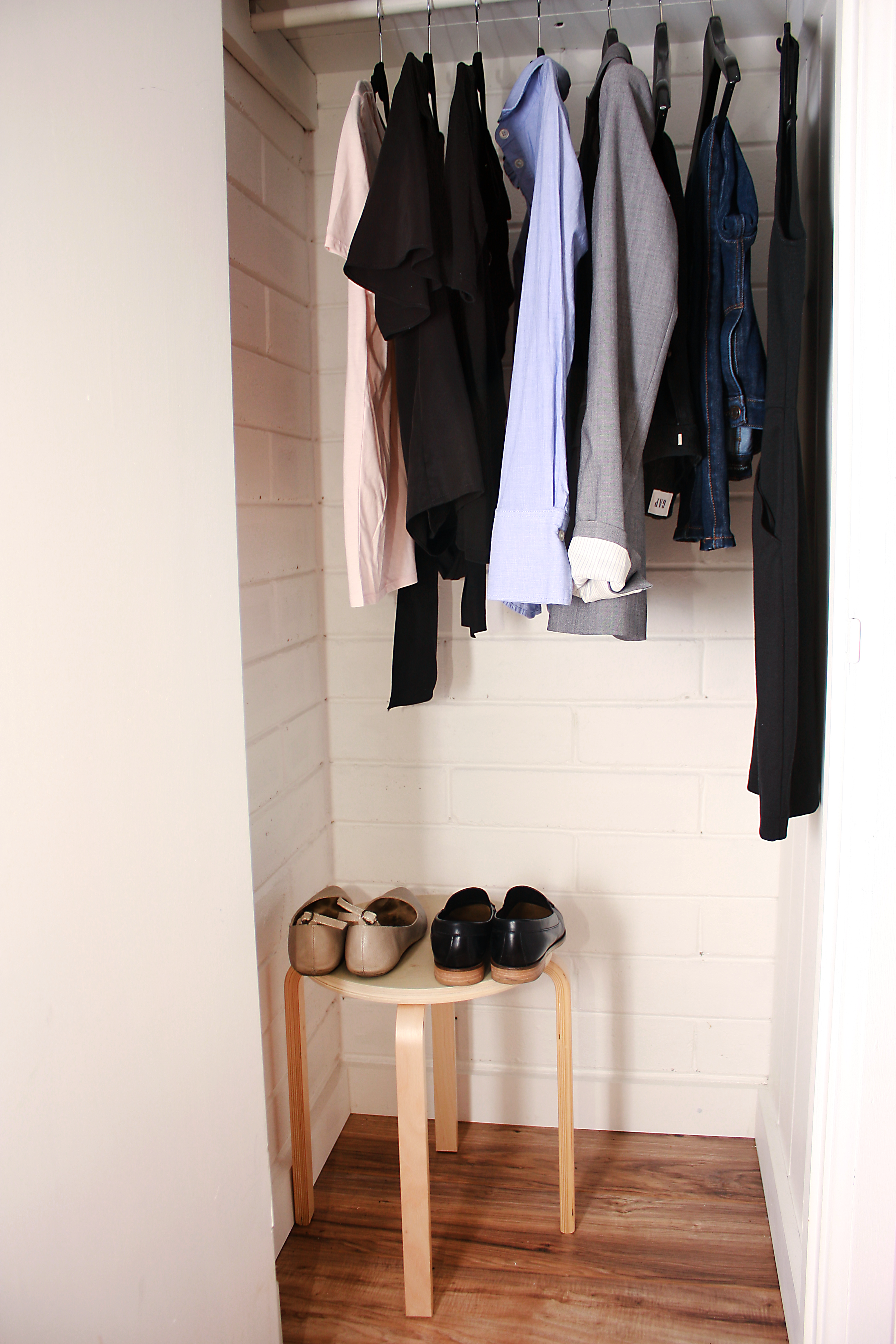 A closet containing ten garments and shoes