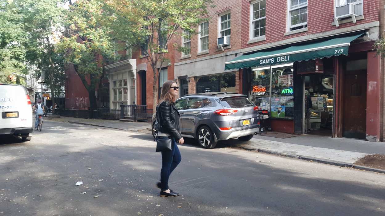 Alyssa crosses the street in NYC