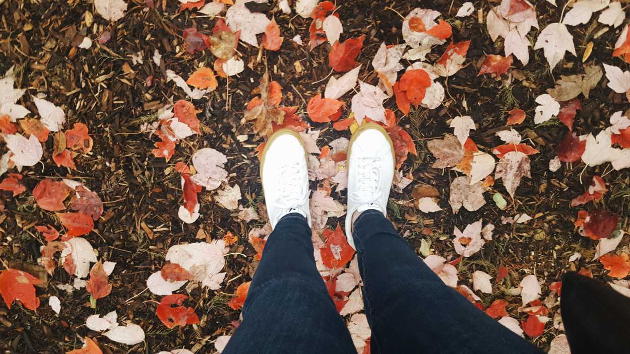 A view of Alyssa's sneakers in the leaves