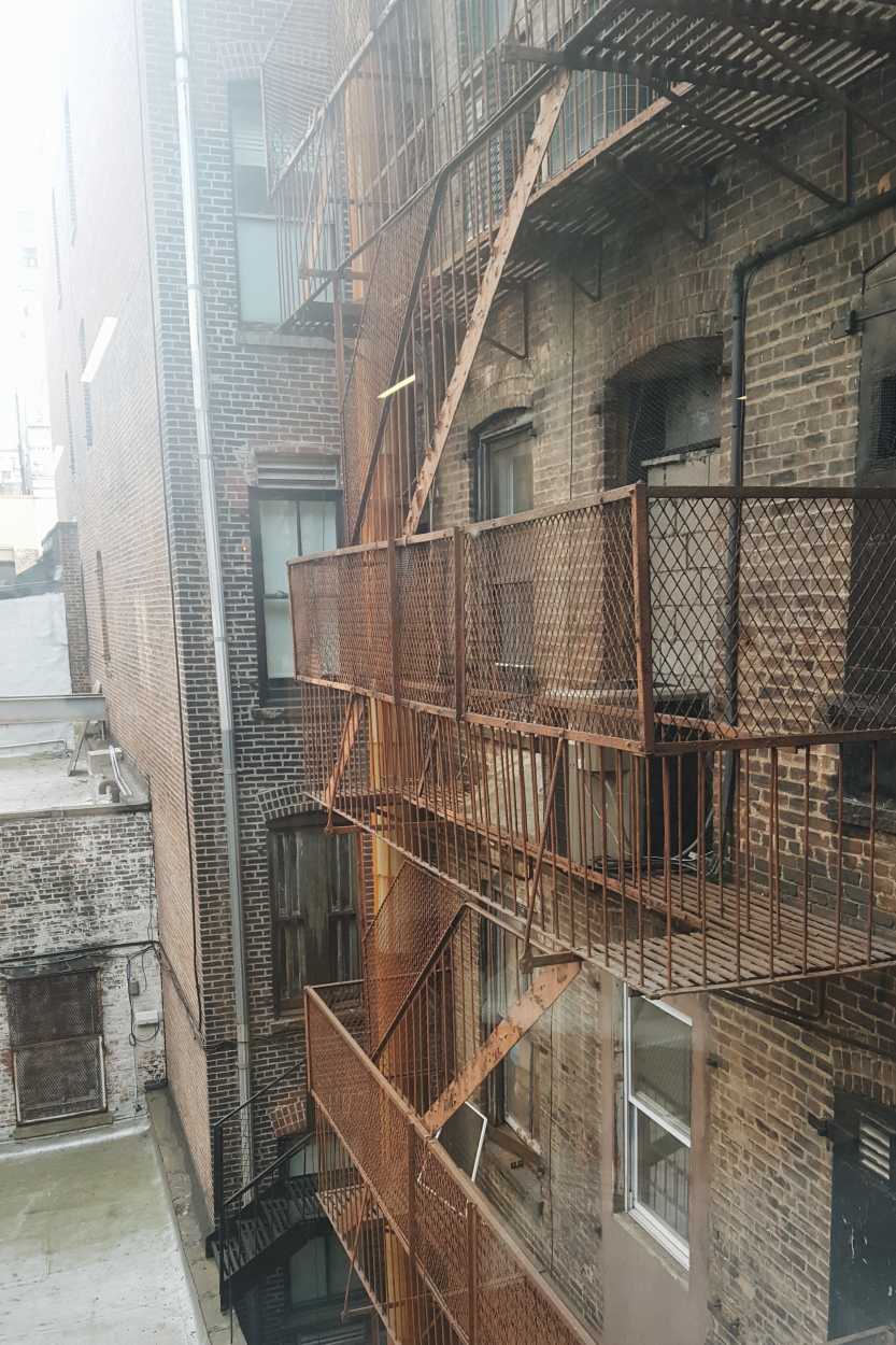 Brick buildings with fire escapes