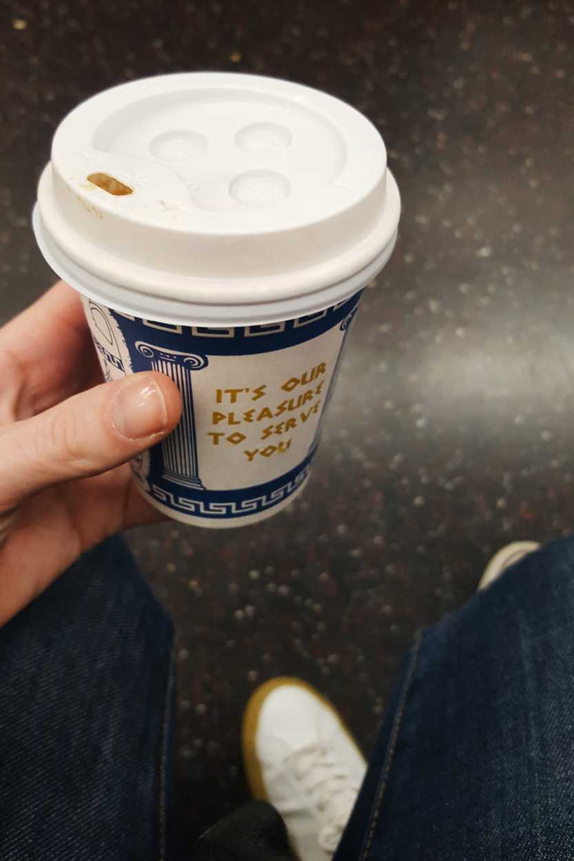 A takeout coffee cup