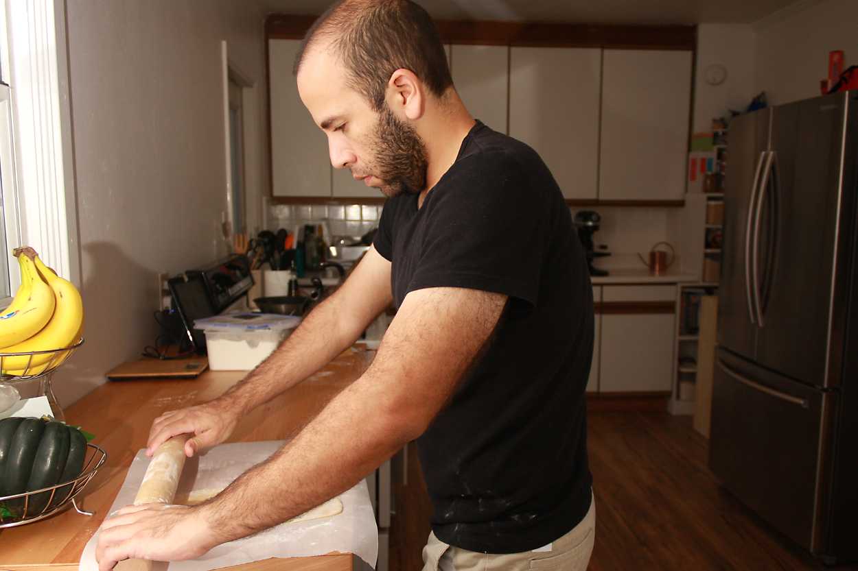 Michael rolls out pasta dough