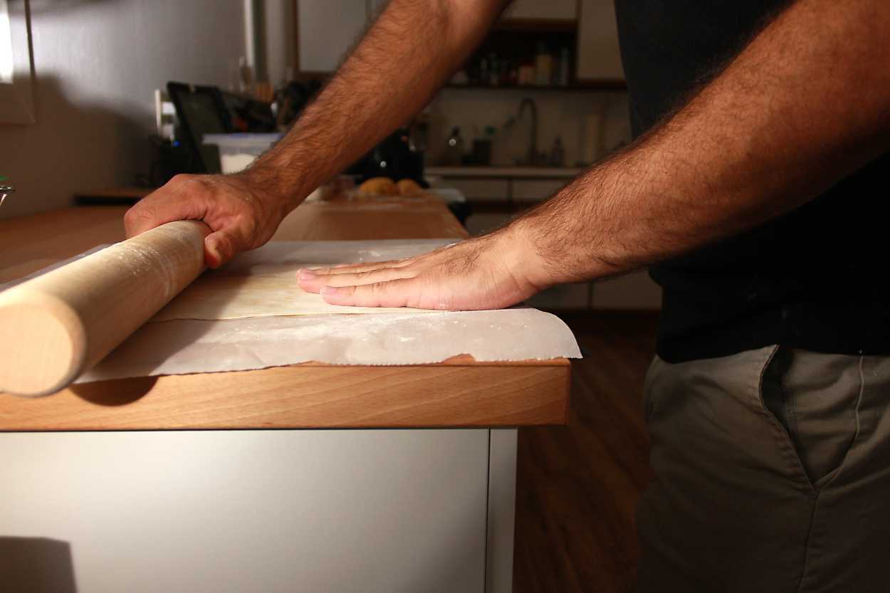 Michael rolls out pasta dough