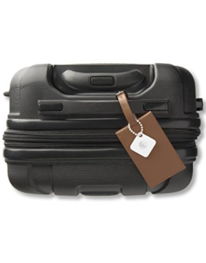 A tile tracker on a suitcase