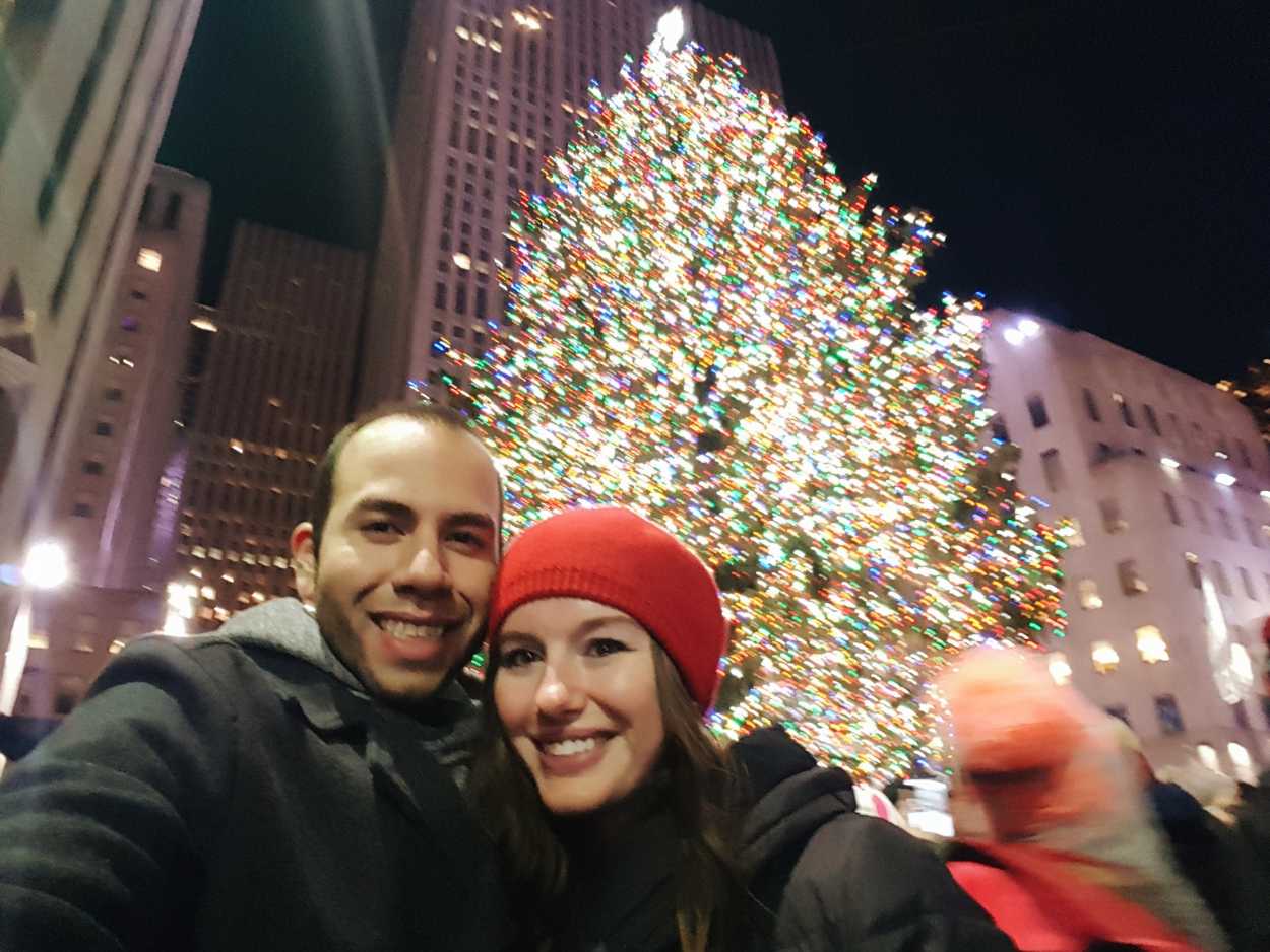 Alyssa and Michael take a selfie in front of the Rockefeller Christmas Tree