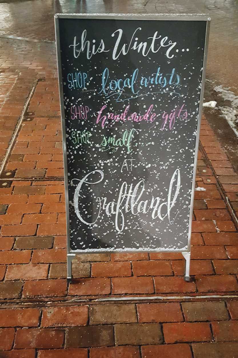 A sandwich board sign advertising Craftland