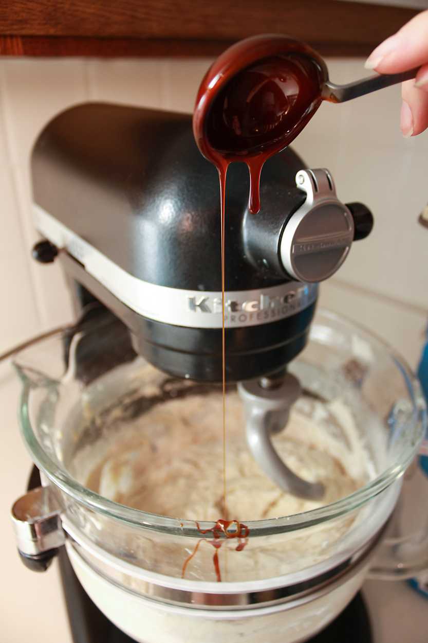 bagel dough malt syrup Adding malt syrup to the bagel dough in a stand mixer