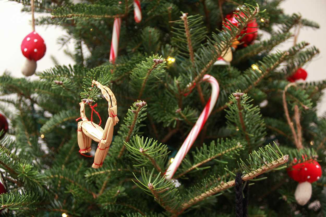 A Christmas Tree with ornaments collected while traveling