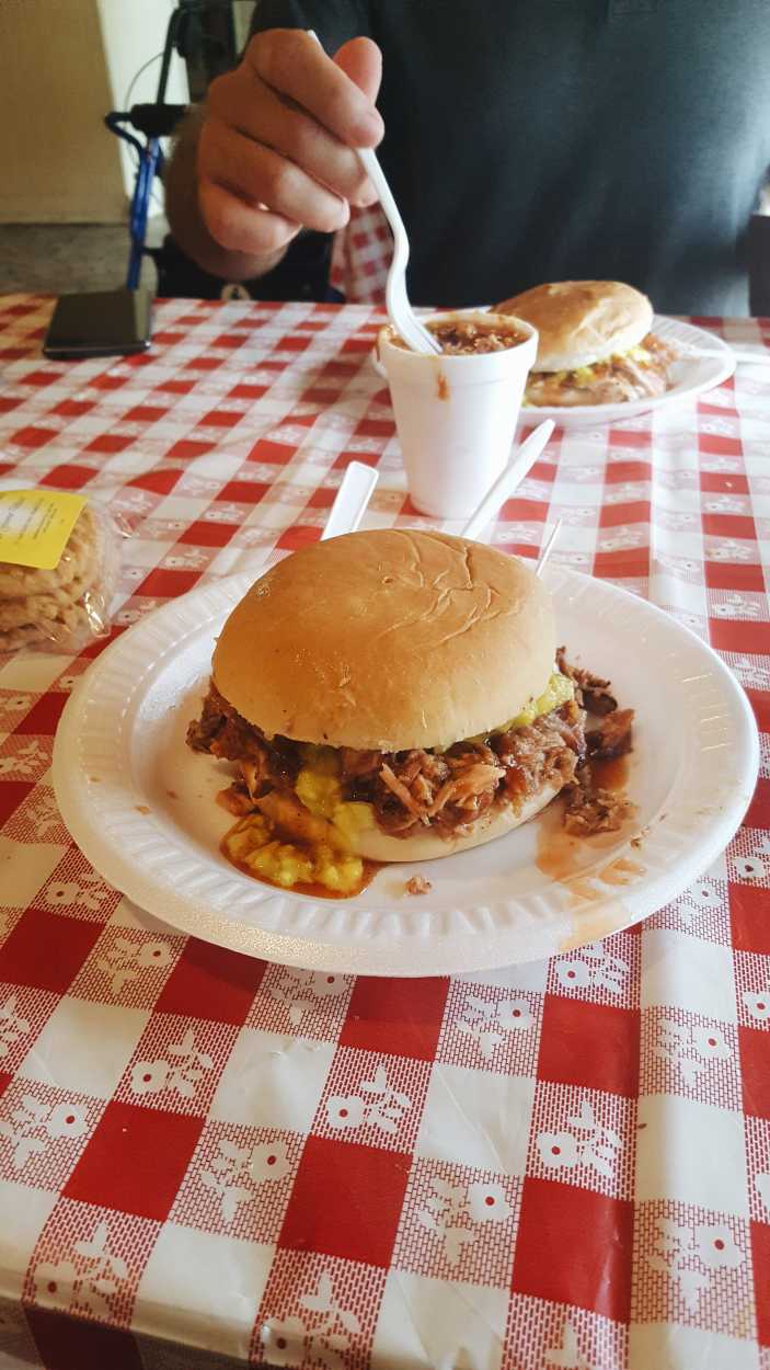 Paynes BBQ Memphis Pulled Pork sandwich on a gingham table