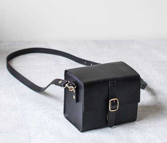 A black leather camera bag