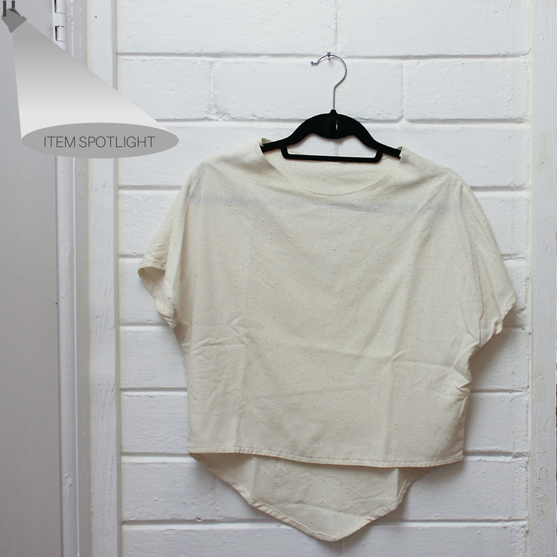 A DIY raw silk tee hangs on a peg