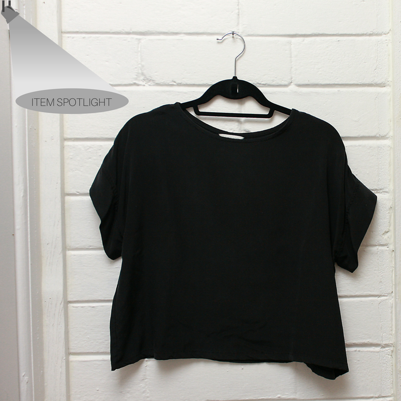 The Georgia Tee from Elizabeth Suzann hangs on a peg