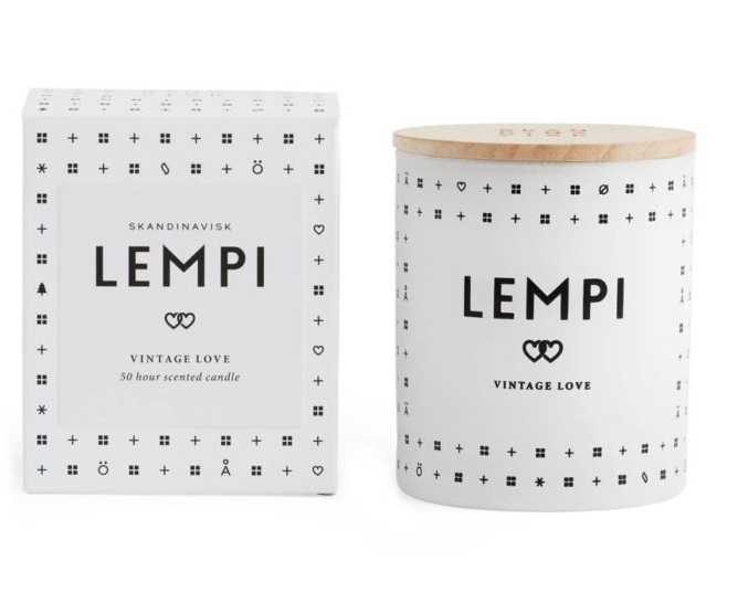 A white candle that reads Lempi