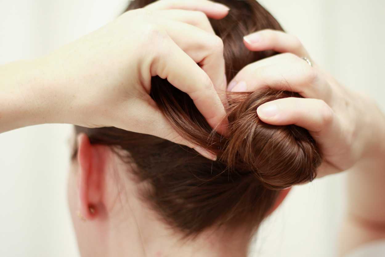 A close up image of a hair updo in progress