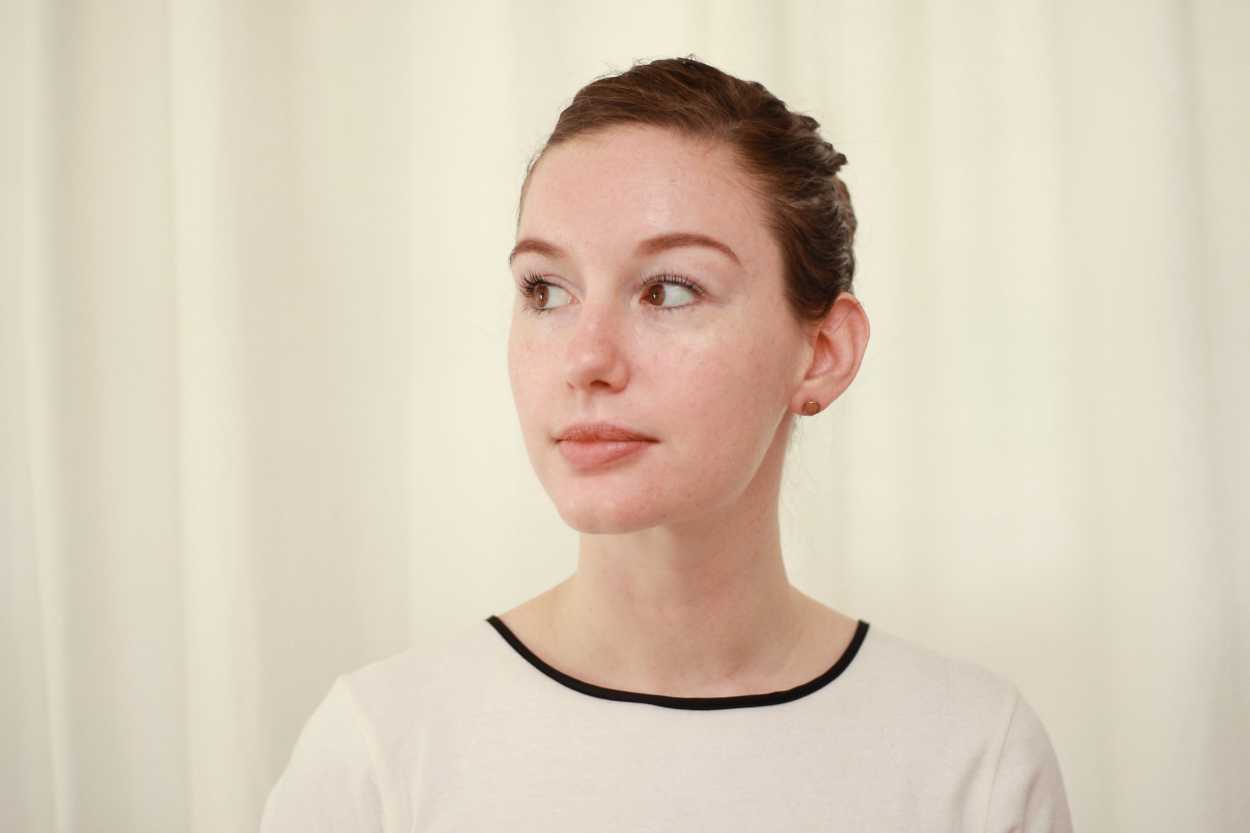 a woman with her hair pulled back in an updo