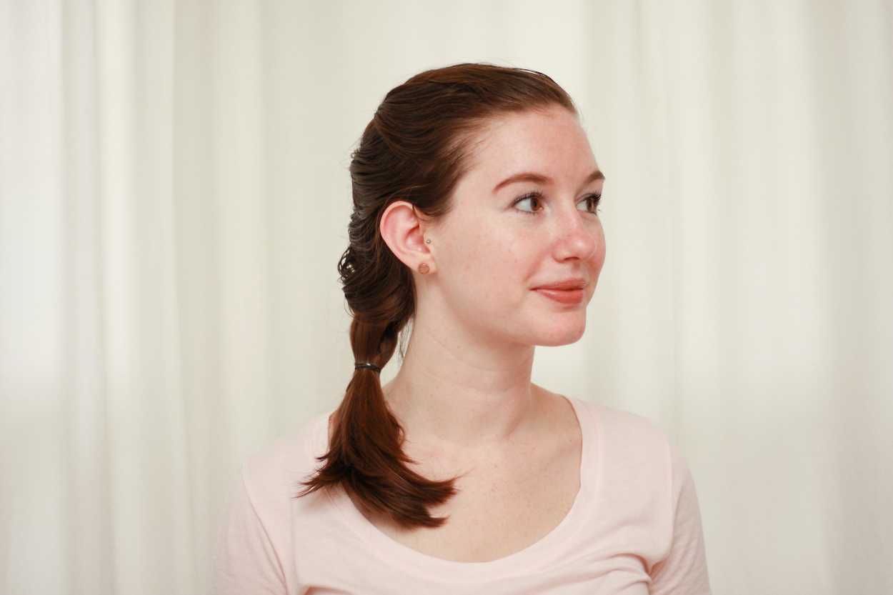 a woman wearing a french braid