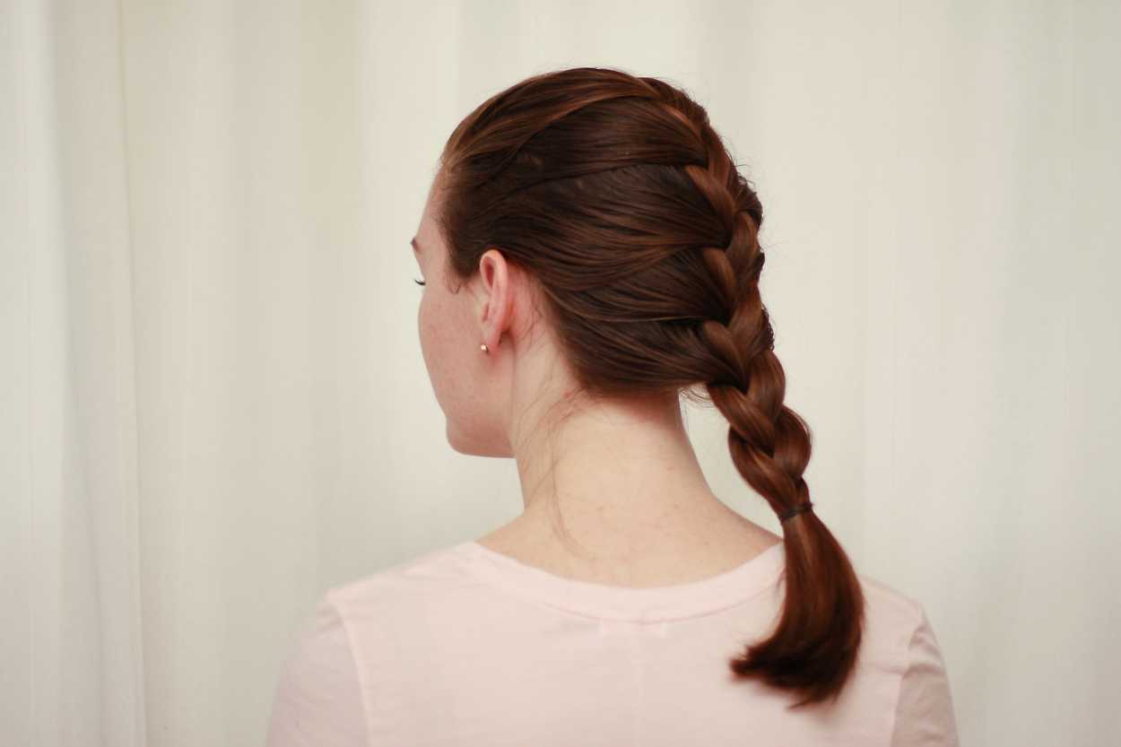 a woman with a French braid