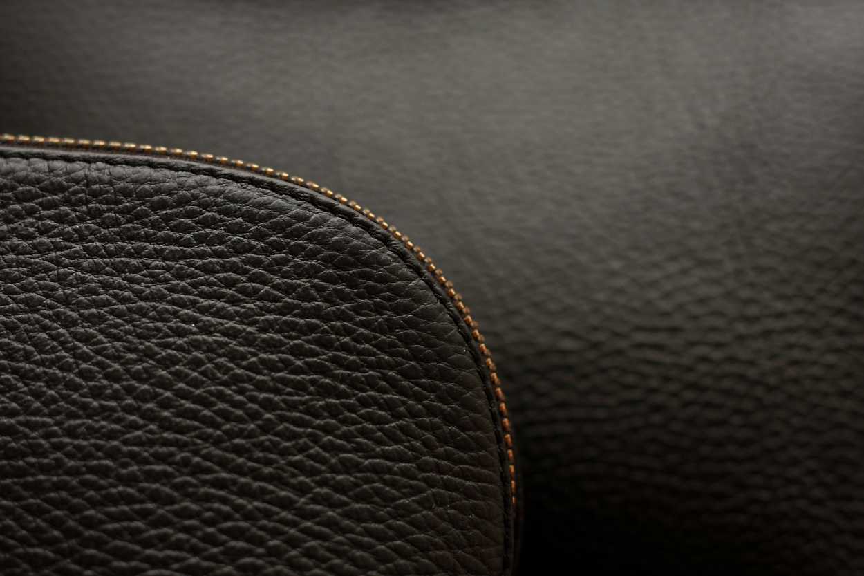 A close up of the edges of the Leather Travel Case Set from Cuyana