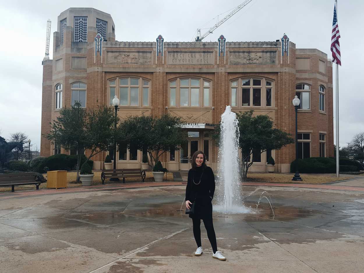 Alyssa stands in front of the National Cowgirl Museum and Hall of Fame