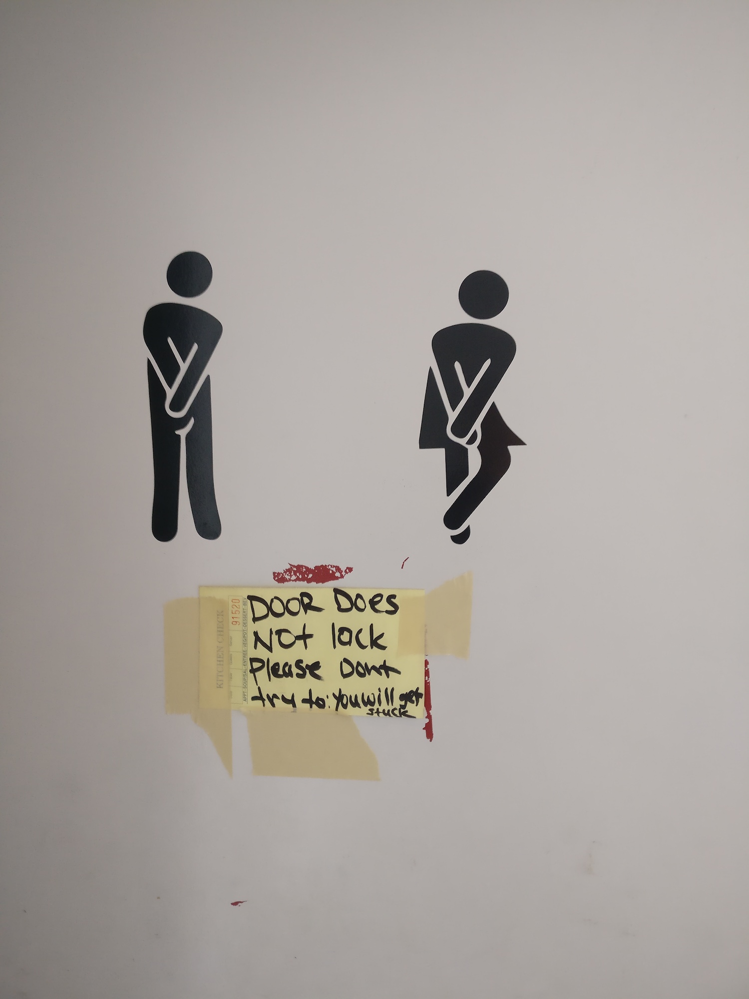 A sign warning people not to lock the bathroom door at Trompo in Dallas