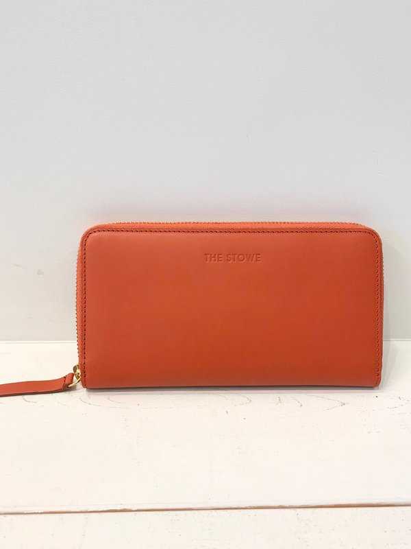 An orange zippered wallet