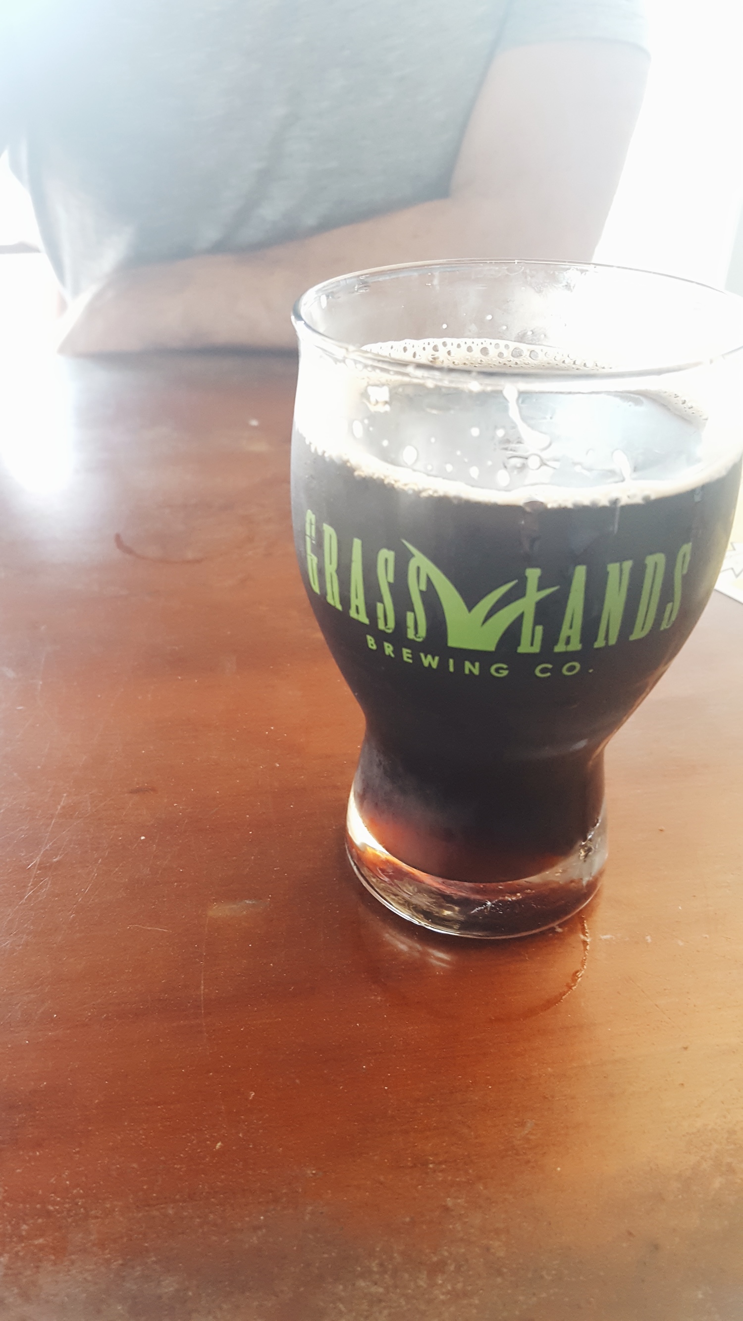 A pint of a dark beer in a glass