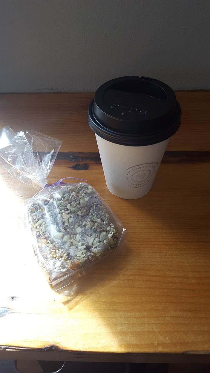 A granola bar and a cup of coffee from Commonplace Coffee
