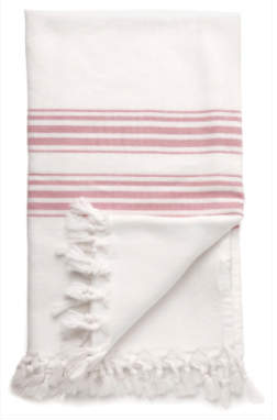 A white Turkish towel with pink stripes