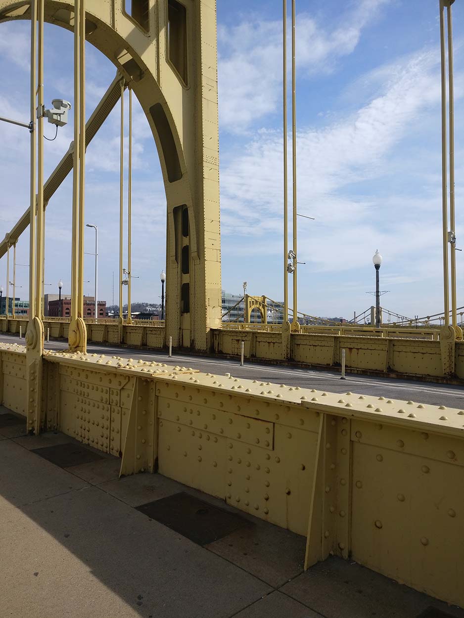 A yellow steel bridge in Pittsburgh