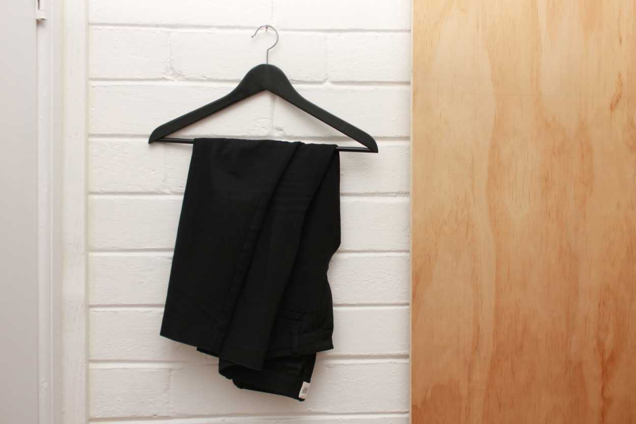A pair of black ankle pants from Gap on a hanger