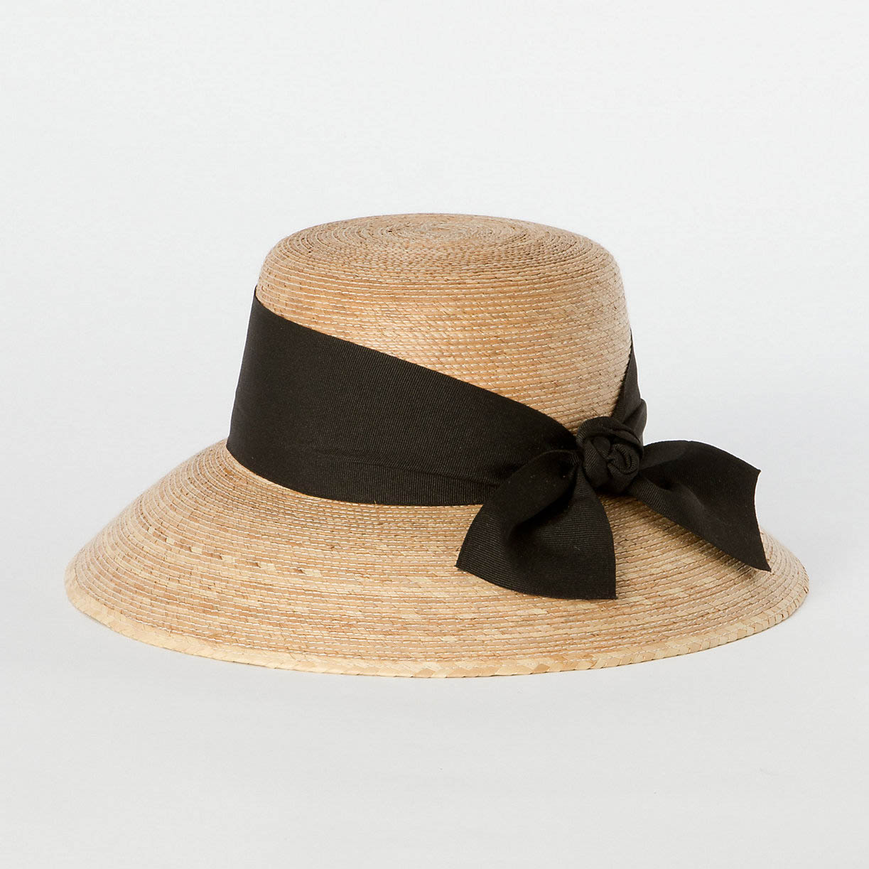 A straw sunhat with a black bow